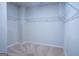 Empty walk-in closet with carpeted floor and metal shelving at 1735 Labonte Pkwy, Mcdonough, GA 30253