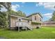 A beautiful two-story home with a charming deck and stairs in a lush green backyard at 3980 Carlton Cove Ct, Loganville, GA 30052