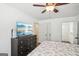 Bedroom boasting a TV, ceiling fan, and ensuite at 3980 Carlton Cove Ct, Loganville, GA 30052