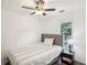 Cozy bedroom with a comfortable bed, window view, and side table at 3980 Carlton Cove Ct, Loganville, GA 30052