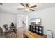 Spacious living area with modern flooring, tv and ceiling fan at 3980 Carlton Cove Ct, Loganville, GA 30052