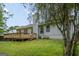 Backyard view featuring a wooden deck and tree-lined perimeter at 9591 Teal Ter, Jonesboro, GA 30238