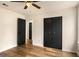 Bedroom features hardwood floors, double-door closet, and connecting doorway at 9591 Teal Ter, Jonesboro, GA 30238