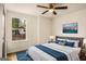 Cozy bedroom with a ceiling fan, ample natural light, and warm hardwood floors at 9591 Teal Ter, Jonesboro, GA 30238