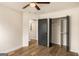 Bedroom features hardwood floors, open closet, and connecting doorway at 9591 Teal Ter, Jonesboro, GA 30238