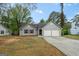 Classic single-story home with attached two-car garage and a curved driveway at 9591 Teal Ter, Jonesboro, GA 30238