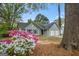 Charming single-story home with a two-car garage and beautiful flowering bushes in the front yard at 9591 Teal Ter, Jonesboro, GA 30238