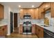 Well-lit kitchen features updated stainless steel appliances, stylish cabinets, and elegant countertops at 9591 Teal Ter, Jonesboro, GA 30238