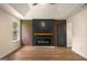 The living room features a modern electric fireplace, fan, tray ceiling, and one window at 9591 Teal Ter, Jonesboro, GA 30238