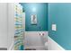 Stylish bathroom featuring a shower with a decorative shower curtain, adding a fresh, modern touch at 368 Yellowwood Dr, Sharpsburg, GA 30277