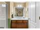 Bathroom featuring a single sink vanity with a white countertop, and green and tan walls at 368 Yellowwood Dr, Sharpsburg, GA 30277