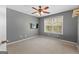 Neutral bedroom with ceiling fan and bright window, creating a relaxing atmosphere at 368 Yellowwood Dr, Sharpsburg, GA 30277