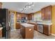 Well-lit kitchen features an island, stainless steel appliances, modern cabinets, and stylish backsplash at 368 Yellowwood Dr, Sharpsburg, GA 30277