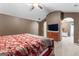Primary bedroom with a ceiling fan, neutral paint, carpeting, and en-suite access at 368 Yellowwood Dr, Sharpsburg, GA 30277