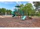 Neighborhood playground with green slides, climbing structure, and a soft surface for to play safely at 368 Yellowwood Dr, Sharpsburg, GA 30277
