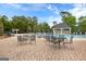Community pool deck with outdoor seating and a gazebo, perfect for relaxing and enjoying the sun at 368 Yellowwood Dr, Sharpsburg, GA 30277