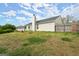 Backyard with a white picket fence and view of the back of the house on a sunny day at 1416 Flanagan Mill Dr, Auburn, GA 30011