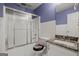 Bathroom features a shower with sliding glass doors, granite vanity and tile flooring at 1416 Flanagan Mill Dr, Auburn, GA 30011