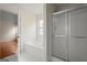 Bathroom showcasing a soaking tub, glass shower, and a window for natural light at 1416 Flanagan Mill Dr, Auburn, GA 30011
