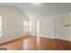 Spacious bedroom with hardwood floors and neutral paint, offering a blank canvas at 1416 Flanagan Mill Dr, Auburn, GA 30011
