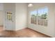 Cozy dining area with natural light, wooden floors, and access to the outdoors at 1416 Flanagan Mill Dr, Auburn, GA 30011