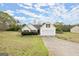 Inviting single-Gathering home with attached two-car garage and manicured lawn and classic design at 1416 Flanagan Mill Dr, Auburn, GA 30011