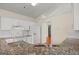 Kitchen featuring granite countertops, white cabinetry and appliances at 1416 Flanagan Mill Dr, Auburn, GA 30011