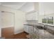 Modern kitchen with granite countertops and stainless steel dishwasher at 1416 Flanagan Mill Dr, Auburn, GA 30011