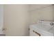 Laundry area with washer, wire shelving for storage and natural light at 1416 Flanagan Mill Dr, Auburn, GA 30011