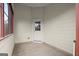 The sunroom includes a tiled floor, white walls and window frames at 1416 Flanagan Mill Dr, Auburn, GA 30011