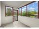 The sunroom has windows with brown frames and a screen door to the backyard at 1416 Flanagan Mill Dr, Auburn, GA 30011