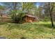 A large backyard and porch provide beautiful and functional outdoor living spaces at 6064 Oak Hill Dr, Austell, GA 30168