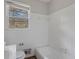 This bathroom features a toilet, bathtub, and sink with vanity at 6064 Oak Hill Dr, Austell, GA 30168