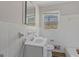 This bathroom features a toilet, sink with vanity, and tiled walls at 6064 Oak Hill Dr, Austell, GA 30168
