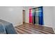 This cozy bedroom features stylish wood flooring, a closet, and colorful curtains at 6064 Oak Hill Dr, Austell, GA 30168