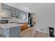 A well-lit kitchen has a peninsula, updated floors, and subway tile backsplash at 6064 Oak Hill Dr, Austell, GA 30168