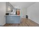 A well-lit kitchen has a peninsula, updated floors, and direct access to a dining space at 6064 Oak Hill Dr, Austell, GA 30168