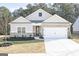 Charming single-story home featuring a brick facade and a well-manicured front yard at 3363 Arabian Farm Ln, Dacula, GA 30019