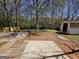 A spacious backyard featuring a shed, patio, and wooden fence, perfect for outdoor activities at 240 Carsons Cv, Mcdonough, GA 30253