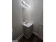 This bathroom vanity features a mirror, lighting, and storage at 240 Carsons Cv, Mcdonough, GA 30253