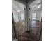 Spacious bedroom featuring wood-look floors, a ceiling fan and a window at 240 Carsons Cv, Mcdonough, GA 30253