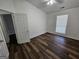 Bedroom featuring hardwood floors, a ceiling fan, and a window at 240 Carsons Cv, Mcdonough, GA 30253