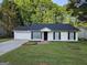 Charming ranch-style home with a well-maintained front yard and a two-car garage at 240 Carsons Cv, Mcdonough, GA 30253