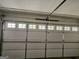 Garage door with windowed panels to allow in natural light at 240 Carsons Cv, Mcdonough, GA 30253