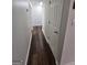 Hallway with hardwood floors, and a closed door at 240 Carsons Cv, Mcdonough, GA 30253