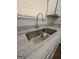 Kitchen sink with stainless steel faucet and countertop at 240 Carsons Cv, Mcdonough, GA 30253