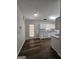 Spacious kitchen with white cabinets, granite countertops and hardwood floors at 240 Carsons Cv, Mcdonough, GA 30253