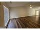 Living room featuring hardwood floors, a ceiling fan, and a large window at 240 Carsons Cv, Mcdonough, GA 30253