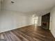 Bright living room with hardwood floors, a ceiling fan, and a stone fireplace at 240 Carsons Cv, Mcdonough, GA 30253