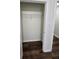 Walk-in closet with white wire shelving and hardwood floors at 240 Carsons Cv, Mcdonough, GA 30253